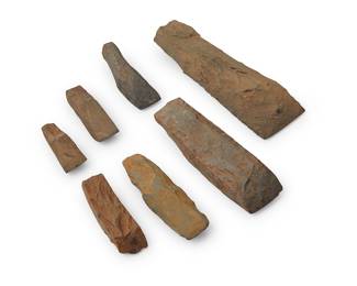 193 A group of seven Hawaiian stone adze blades Hawaiian Islands 7 pieces Lengths 3 1/2-10 in. Estimate: $2,000 - $3,000