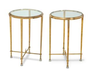 389 A pair of Neoclassical style brass tabourets 20th century Each in the Manner of Maison Meilleur, with glass top 2 pieces Height of each 24 1/2 in., diameter 15 1/2 in. Estimate: $1,000 - $1,500