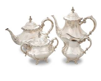 25 A Reed & Barton sterling silver 'Georgian Rose' tea and coffee service 1941-2005 Comprising: Coffee pot (height 9 5/8 in., width 10 1/2 in., depth 5 in.) Teapot (height 8 1/8 in., width 10 5/8 in., depth 5 3/8 in.) Covered sugar bowl (height 6 1/2 in., width 7 1/2 in., depth 4 1/4 in.) Creamer (height 5 1/2 in., width 5 3/4 in., depth 3 3/8 in.) Each with factory marks for sterling and numbered '670' 4 pieces Total weight 74.6 gross oz. troy approximately Estimate: $2,000 - $3,000