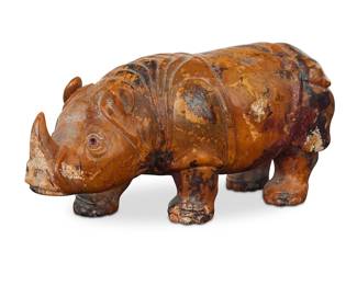 `338 A carved hardstone rhinoceros 20th century or earlier With ruby-colored inset eyes Height 2 3/8 in., width 5 1/4 in., depth 2 1/8 in. Estimate: $300 - $500