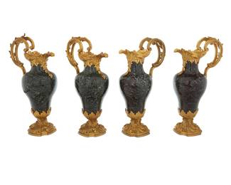 145 A set of four Louis XV style gilt bronze mounted marble ewers 20th century Each appears unmarked 4 pieces Height of each 17 1/2 in., width 9 5/8 in., depth 6 1/2 in. Estimate: $1,200 - $1,800