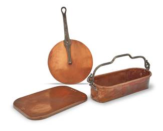 392 A group of three French copper pieces of cookware 19th century Comprising a J. Cusden copper fish kettle with iron handle, a stove-top warming plate/drip tray, and a E. Dehillerin lid for a pot with iron handle Fish kettle and lid impressed with maker's mark, the kettle monogrammed 3 pieces Height of kettle 5 3/4 in., width 19 1/4 in., depth 8 1/4 in.; tray 15 1/4 x 11 1/4 in.; diameter of lid 12 1/8 in. Estimate: $700 - $900