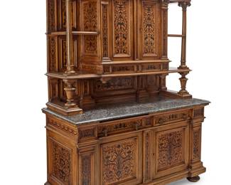 89 A Renaissance Revival walnut marquetry buffet Late 19th century Profusely inlaid with peacocks, eagles, stags, beast heads, and scrolling foliate motifs throughout, the upper console with two shelves supports on Corinthian columns, flanking a central locking cabinet, opening to reveal a single shelf, the lower cabinet with granite top above two locking drawers and two locking doors, each opening to reveal a single shelf, raised on bun feet Height of upper 53 1/2 in., width 61 1/2 in., depth 20 in.; height of lower 34 in., width 61 1/2 in., depth 25 1/2 in.; overall height 88 in. Estimate: $2,000 - $3,000