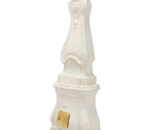 361 A Continental Baroque style white glazed ceramic oven 19th/20th century With open back and brass door Height 94 in., width 31 in., depth 19 in. Estimate: $700 - $1,000