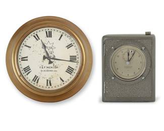 334 A Mercer English electrically wound naval clock Second and third quarter 20th century The Mercer Marine Chronometer electrically rewound for British Navy, together with a T & F Mercer wall clock, electrified Marked to dial: THOMAS MERCER / ST. ALBANS, ENGLAND / 1122; wall clock also with factory marks to dial 2 pieces Height of Marine 11 1/2 in., width 9 1/8 in., depth 5 3/4 in.; height of wall clock 16 5/8 in., diameter 3 3/8 in. Estimate: $1,000 - $2,000