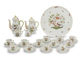 9 A Herend porcelain 'Rothschild Bird' tea service Late 20th century Comprising: 2 teapots, 1612 (height 8 1/2 in., width 6 3/4 in., depth 4 1/2 in.) 1 covered sugar, 444 (height 3 5/8 in., width 4 3/4 in.) 1 cream jug, 1644 (height 3 1/4 in.) 12 teacups, 709 (height 2 3/8 in.) 12 saucers, 711 (4 5/8 in.) 1 circular tray, 439 (14 5/8 in.) Various blue printed factory marks, above shape numbers and pattern code RO, some impressed 'HEREND' and shape numbers 29 pieces Estimate: $800 - $1,200