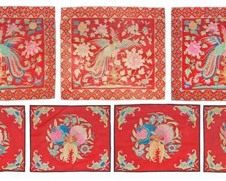 55 Seven Chinese embroidered silk textile fragments Late Qing/Republic period (circa 1840-1949) or later A group of rectangular embroidered lined panels, each with polychrome silk and gilt-thread embroidered motifs, comprising four mats each depicting 'Sanduo' or 'Three Abundances' motifs including a Buddha's hand citrus, a pomegranate, and a peach, with a stylized bat to the center and each corner, as well as three larger mats each featuring a central Phoenix motif surrounded by various floral and foliate motifs 7 pieces The first each 14 x 17 in.; The second each 19 x 22 in. approximately Estimate: $1,000 - $1,500