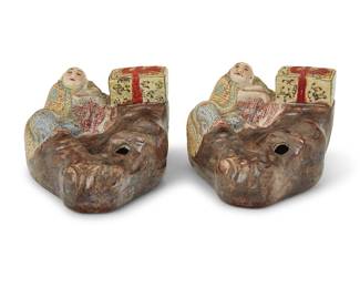 111 A pair of Chinese molded porcelain figural water droppers Late Qing dynasty/Republic era (1644-1949) Each in the form of sages on rocks With applied labels: Made in China 2 pieces Height of each 2 1/8 in., width 3 3/4 in., depth 3 1/4 in. Estimate: $1,200 - $1,800
