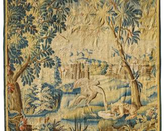 87 A Franco Flemish verdure tapestry 18th/early 19th century Depicting a crane and wolf drinking from a basin or puddle, a possible variation on Aesop's Wolf and Crane classic fable, all set within a landscape with trees in the foreground and buildings in the mid- and far-distance, woven in polychrome wool and silk threads 7 ft. 1 in. x 7 ft. 1/2 in. approximately Estimate: $3,000 - $5,000