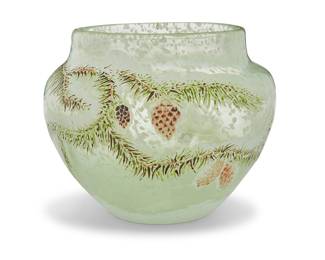231 An Emile Gallé enameled glass vase 1890s The glass impregnated with white inclusions ("snow"), the exterior painted with pine boughs and cones in a winter tableau Gilt-etched to underside in stylized lettering: Gallé / déposé Height 6 5/8 in., diameter 8 1/2 in. Estimate: $1,500 - $2,500