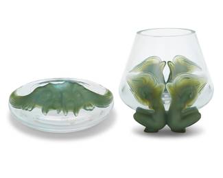 381 A Lalique glass 'Yeso Antinea' bowl and 'Antinea' vase Late 20th/early 21st century Designed by Marc Lalique (1900-1977) Each etched: Lalique ® France 2 pieces Height of vase 7 3/4 in., width 10 3/4 in., depth 8 1/2 in.; height of bowl 4 1/8 in., diameter 9 1/4 in. Estimate: $1,000 - $1,500