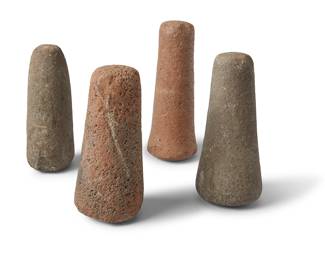189 Four Hawaiian carved stone pestles/pounders Hawaiian Islands 4 pieces Heights 6 1/4-7 in. Estimate: $1,200 - $1,800