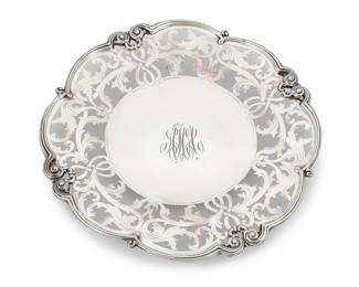 14 A Bigelow, Kennard & Co. sterling silver reticulated dish Late 19th/early 20th century With factory marks for sterling and numbered: 2185/10 Diameter 10 1/4 in. 11.2 oz. troy approximately Estimate: $500 - $700