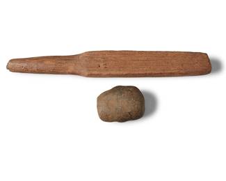 192 A Kapa carved wood beater and stone hand weapon Hawaiian Islands 2 pieces Length of beater 14 1/2 in.; length of weapon 3 3/8 in. Estimate: $600 - $900