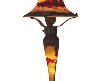 247 A Mueller Freres cameo glass landscape boudoir lamp Early 20th century The single-socket lamp with metal base, the standard and shade depicting a shoreline scene with trees and reeds, electrified Marked in the cameo: MULLER FRES Height 15 3/4 in., diameter 7 7/8 in. Estimate: $1,000 - $2,000