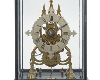 333 Chester Henry Pond (1844-1912) A self winding electromechanical mantel clock With open escapement in a glazed case, the silvered metal dial bearing Roman numerals, electrified Marked to applied metal plaque: Chester h. Pond Height overall 15 1/2 in., width 12 in., depth 8 1/2 in. Estimate: $400 - $600