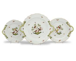 8 Three Herend porcelain 'Rothschild Bird' graduated serving platters 20th century All circular, flanked by branch handles Comprising: 1 platter, 1172 (width across handles 11 3/4 in.) 1 platter, 1173 (width across handles 14 1/4 in.) 1 platter, 1178 (width across handles 17 in.) Various blue printed factory marks above shape and pattern code RO, impressed 'HEREND' and shape numbers 3 pieces Estimate: $700 - $900
