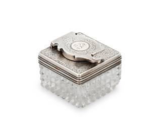 35 An English sterling silver and cut glass travelling inkwell John Howe, London, circa 1844 With monogram and foliate engraved and engine-turned silver mount with screw lock over a cut glass reservoir Impressed: London 1844 JH Height 1 1/2 in., width 1 3/4 in., depth 1 3/4 in. Estimate: $200 - $300