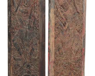 370 A pair of Thai carved wood temple doors Circa 1825 Carved with warriors armed with swords, small animals, and floral motifs 2 pieces Height of one 60 3/4 in., width 21 5.8 in., depth 2 1/2 in.; height of the other 60 3/4 in., width 20 5/8 in., depth 2 1/4 in. Estimate: $700 - $900