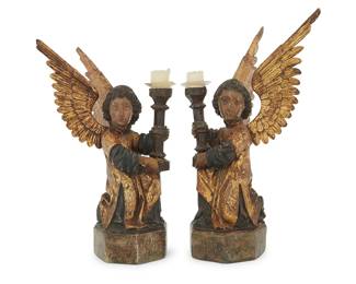 307 A pair of German parcel gilt carved wood angel candle holders Early 16th century; South Germany Each with later glass bobèche 2 pieces Height of taller 20 3/4 in., width 12 in., depth 8 1/2 in., height of shorter 19 1/4 in., width 11 1/2 in., depth 9 1/4 in. Estimate: $800 - $1,200