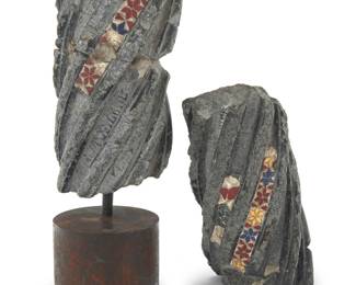 96 Two French Solomonic Cosmati mosaic stone column fragments 12th-13th century The spiral fluting with a small residue of the original Cosmatesque mosaic work executed in sard red, lapis blue, and amber hues, one mounted on an iron base 2 pieces Height of each 10-10 1/2 in., diameters 5 1/4-5 1/2 in.; height of stands 3 1/4 in., diameter 4 3/4 in. Estimate: $600 - $800