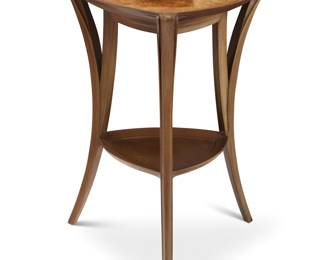 226 A Louis Majorelle style burlwood and fruitwood gueridon 20th century With three legs joined by a shelf stretcher Unmarked Height 32 in., width 22 1/2 in., depth 22 1/2 in. Estimate: $800 - $1,200