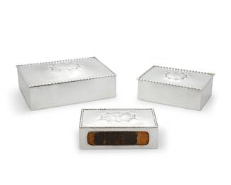 41 A set of three Georg Jensen sterling silver boxes Circa 1915-1932 Comprising:  A cigar box, model 195 Marked for maker, sterling, and model Height 2 1/2 in., width 7 1/8 in., depth 5 1/4 in.  A cigarette box, model 39 Marked for maker, sterling, model, and: DESSIN / GI / DENMARK Height 2 in., width 5 3/8 in., depth 3 7/8 in.  A match box, model 83 Marked for maker, .830 silver, model, and: [crown] / GABF / 1919 / [three crowns] Height 1 3/4 in., width 4 7/8 in., depth 2 7/8 in.  3 pieces Estimate: $1,200 - $1,500