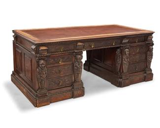 91 A Renaissance Revival carved oak pedestal desk 19th/early 20th century The leather-inset top with crenellated edge above three drawers to one side, one locking, raised on three-drawer pedestals, each front with locking mechanism and carved foliate motifs, flanked by half-length pilasters 3 pieces Height overall 30 1/4 in., width 74 1/2 in., depth 38 in.; height of each pedestal 23 3/4 in., width 26 1/2 in., depth 37 1/2 in. Estimate: $1,000 - $1,500