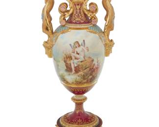 169 A Berlin Vienna style porcelain vase Late 19th/early 20th century Painted with a figural scene to either side With underglaze blue scepter mark, overglaze blue shield mark, and impressed: S 2 Height 24 1/2 in., width 10 1/4 in., depth 8 3/8 in. Estimate: $1,200 - $1,500