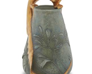 230 An Amphora glazed earthenware lizard vase Circa 1920 Stamped to underside: Made in Czecho-Slovakia / AMPHORA Height 7 3/4 in., width 4 7/8 in., depth 4 5/8 in. Estimate: $500 - $700