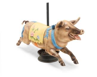 288 A Continental polychrome wood carousel jumper pig In the manner of the Gustave Bayol Carousel Company, late 19th/early 20th century Raised on an enameled metal support pole and metal base Unmarked Height 44 in., width 72 in., depth 23 in. approximately Estimate: $600 - $900