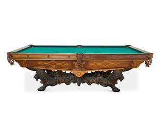 275 A Brunswick Balke Collender marquetry rosewood 'Monarch' pool table Late 19th century with later elements Inlaid with fruitwood foliate designs, with leather pockets, raised on a cast-iron lion head and paw base, including a Brunswick Balke Collender wall-mounted pool cue rack with fifteen cues, a rack of balls, and racking triangle Inset metal tag: THE BRUNSWICK-BALKE-COLLENDER CO. / MONARCH CUSIONS 2 pieces Height of table 34 1/2 in., width 110 in., depth 60 in.; height of rack 65 in., width 42 1/2 in., depth 5 3/4 in. Estimate: $10,000 - $15,000