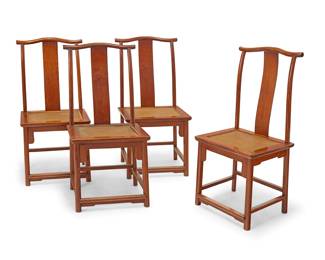 68 A set of four Chinese Huanghuali and hardwood yoke back chairs High Qing dynasty elements (1680-1790s) Each with yolk crest rail, S-curve back splat, and woven seat panel above shaped apron and straight legs joined by a box stretcher 4 pieces Height of each 42 1/4 in., width 20 in., depth 18 in. Estimate: $20,000 - $30,000