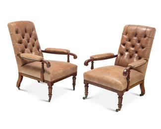 304 A pair of Victorian mahogany library armchairs Late 19th century Each upholstered in tufted leather, raised on casters 2 pieces Height of each 38 1/2 in., width 26 3/4 in., depth 36 in. Estimate: $800 - $1,200