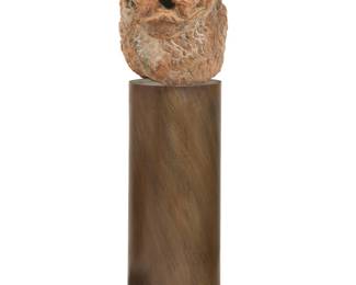 101 A Romanesque style carved red marble lion fountainhead possibly 12th century Raised on a later bronze pedestal made by Greg Higgins (20th/21st Century) Height 20 1/2 in., width 25 in., depth 14 in.; height of pedestal 42 in., diameter 15 in. Estimate: $1,500 - $2,000