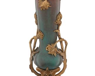 250 A French Art Nouveau gilt bronze mounted ceramic vase Circa 1900 Appears unmarked Height 16 1/4 in., width 6 3/8 in., depth 5 in. Estimate: $700 - $900