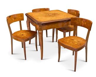 395 An Italian inlaid walnut games table and four chairs Second half 20th century The clip-corner square tabletop with floral marquetry and with cork backgammon board on the verso, the apron and each seat and seatback profusely inlaid with floral motifs, the table housing a green felted card playing surface with chess/checkers on the verso, roulette wheel and felted board, and various game pieces 5 pieces Height of table 29 3/4 in., width 34 1/2 in., depth 34 1/2 in.; height of each chair 31 in., width 17 1/2 in., depth 19 1/2 in. Estimate: $500 - $700