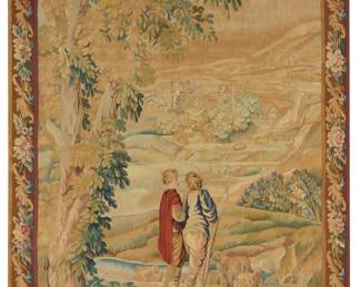86 An Aubusson tapestry 19th century Depicting two figures and sheep before a mountain scene with buildings in the mid-distance, within a floral and scrolled leaf border, all woven in polychrome wool and silk threads Sight 6 ft. 5 1/4 in. x 4 ft. 6 1/2 in. Estimate: $800 - $1,200