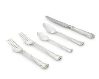 30 A Tiffany & Co. sterling silver 'Provence' part flatware service Mid-20th century Directorship of William T. Lusk (1956-1965) Designed 1956 by Oscar Riedener (1901-2000) Comprising: 4 dinner knives 5 dinner forks 4 salad forks 4 oval soup spoons 4 teaspoons Each with factory marks for sterling 21 pieces Total weighable sterling 35 oz. troy approximately Estimate: $1,000 - $1,500