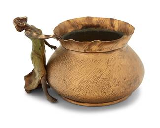 245 A Viennese bronze figural jardinière Early 20th century With cold-painted dancer figure mounted to side of gilt-bronze planter with interior metal liner Height 4 1/4 in., width 6 3/4 in., depth 5 1/2 in. Estimate: $300 - $500