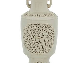 114 A Chinese reticulated white porcelain vase Early 20th century Impressed with seal and: MADE IN CHINA Height 12 1/4 in., diameter 5 3/4 in. Estimate: $600 - $900