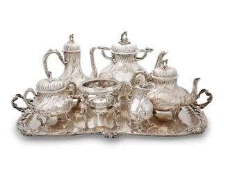 37 A French Rococo Revival .950 silver six piece tea and coffee service Jean-Baptiste François, Paris, circa 1900 Embellished with repoussé and chased rocailles, scrolls, and asymmetric florals, each monogrammed Comprising: Hot water kettle on stand (overall height without handle 15 1/2 in., diameter 7 5/8 in.) Teapot (height 7 3/4 in., width 9 1/8 in., diameter 6 1/4 in.) Coffee pot (height 10 3/8 in., width 8 1/4 in., diameter 5 3/4 in.) Lidded sugar (height 6 5/8 in., width 7 in., diameter 5 1/4 in.) Cream jug (height 5 5/8 in., width 4 1/2 in., depth 3 3/8 in.) Handled tray (width 27 1/2 in., depth 19 3/8 in.) Each hallmarked with a lozenge-shaped silver maker's mark with the initials JBF and a Boar's Head, Minerva Head with number 1 before the forehead, within a geometric frame-shaped cartouche (rectangular with clipped corners) 6 pieces Total weight 253.4 gross oz. troy approximately Estimate: $10,000 - $15,000
