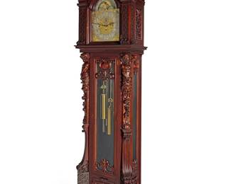 281 A Walter Durfee mahogany quarter chiming tall case clock Late 19th century, retailed by Tiffany & Co. The three-train movement striking on tubes, with arched dial having silvered chapter ring, Arabic hours, subsidiary seconds, "Chime/Silent" and "Westminster Chime/Chime on Eight Bells" dials, and sun and moon phase to the arch, housed in a mahogany case with fretwork and glazed front flanked by bearded Atlantes figures, the bonnet crested by a scrolling foliate pediment Dial marked: TIFFANY & CO. NEW YORK; movement marked: WALTER H. DURFEE / PROVIDENCE / RI; each chime marked: WALTER H DURFEE & CO. PROV. RI / PAT. NOV 8 87 SEP 18 88 NOV 1 92 OCT 6 96 Height 8 ft. 7 1/2 in., width 28 3/4 in., depth 16 1/2 in. Estimate: $4,000 - $6,000
