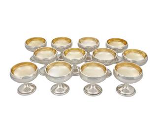 15 A set of twelve American weighted sterling silver sherbet cups G. H. French; North Attleboro MA, 1920-1939 With gold-washed interiors Each marked: STERLING GHF [in shields] Height of each 3 in., diameter 3 1/4 in. Estimate: $600 - $800