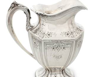 34 A Wright, Kay & Co. sterling silver pitcher Early 20th century With chased and repoussé foliate and floral motifs Marked to underside: WRIGHT, KAY & CO / STERLING / 7060 / 5 1/8 PTS. / [lion statant]; monogrammed: VMPB Height 10 in., width 8 7/8 in., depth 5 in. 35.5 oz. troy approximately Estimate: $1,500 - $2,000