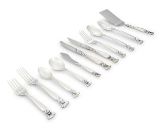 32 A Wallace sterling silver 'Romance of the Sea' flatware service Mid/late 20th century Designed 1950 by William S. Warren Comprising: 8 dinner knives 8 steak knives 8 dinner forks 8 salad forks 8 teaspoons 1 sugar spoon 1 master butter knife 1 serving spoon 1 slotted serving spoon 1 serving fork 1 lasagna server Each with factory marks for sterling 46 pieces Total weighable sterling 52.1 oz. troy approximately Estimate: $2,000 - $4,000