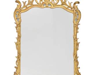 153 A Rococo style giltwood mirror 19th/20th century With openwork foliate border crested by roses, the corners and crest with small mirrored panels Height 77 3/4 in., width 49 in., depth 6 1/4 in. Estimate: $1,000 - $2,000