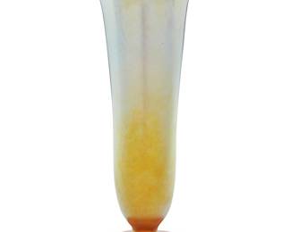 239 A Tiffany Favrile glass vase Early 20th century Etched to underside: 1556 2801 M / L. C. Tiffany Inc Favrile Height 12 3/4 in., diameter 5 1/8 in. Estimate: $800 - $1,200