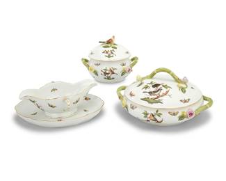 10 Three Herend porcelain 'Rothschild Bird' serving pieces Late 20th century Comprising: 1 covered dish, 28 (height 6 in., width 7 1/2 in., depth 6 in.) 1 covered dish, 2086 (height 5 7/8 in., width 11 1/8 in., depth 9 in.) 1 open sauce boat, 1220 (height 31/4 in., width 9 1/4 in., depth 6 7/8 in.) 1 associated tray, 211 (10 3/8 x 8 1/4 in.) Each with blue printed factory marks, above shape numbers and pattern code RO, some impressed with shape numbers 4 pieces Estimate: $600 - $800
