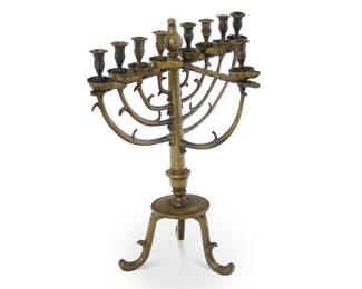 348 A Russian brass synagogue menorah Circa 1900 Unmarked With nine lights, raised on a tripod base Height 29 in., width 26 3/4 in., depth 17 in. Estimate: $1,200 - $1,800